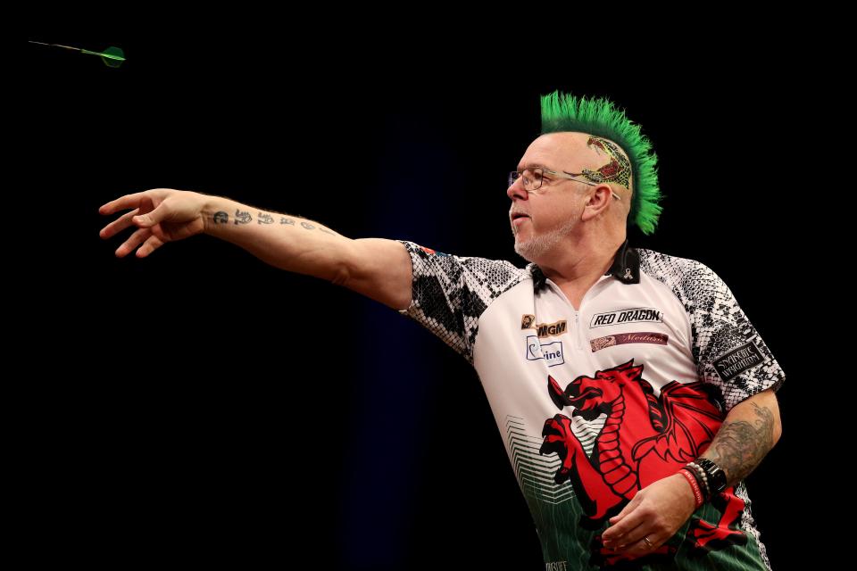 Peter Wright in action on stage in Cardiff (Getty Images)