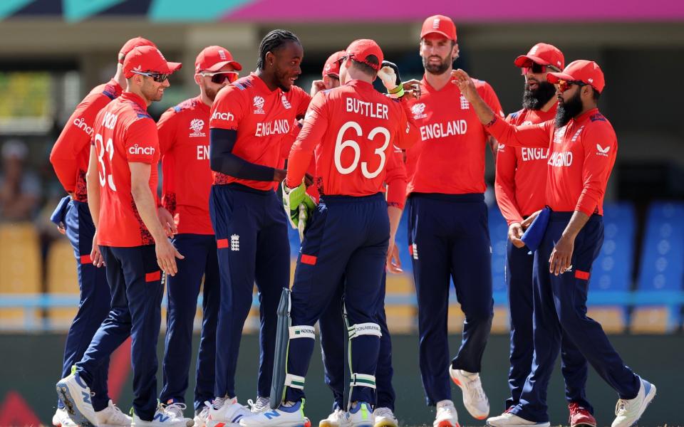 England celebrate the early wicket of Pratik Athavale.