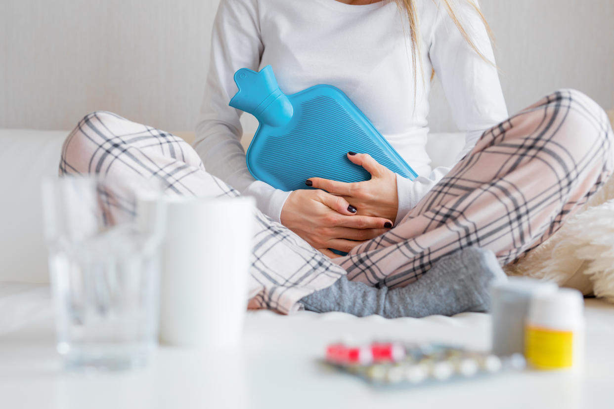 Hot water bottles come in various sizes, from pocket-sized miniatures to extra-long styles. (Getty Images)