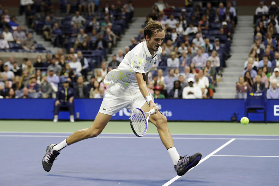 Daniil Medvedev, of Russia, returns a shot to Grigor Dimitrov, of Bulgaria, during the men's singles semifinals of the U.S. Open tennis championships Friday, Sept. 6, 2019, in New York. (AP Photo/Adam Hunger)