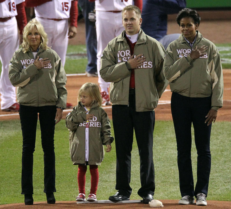 ST LOUIS, MO - OCTOBER 19: (L-R) Dr. Jill Biden, army veteran Red Schoendienst and first lady Michelle Obama stand on the mound prior to the start of Game One of the MLB World Series between the Texas Rangers and the St. Louis Cardinals at Busch Stadium on October 19, 2011 in St Louis, Missouri. (Photo by Jamie Squire/Getty Images)