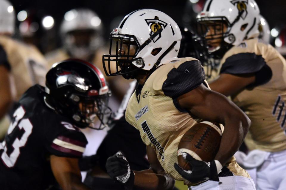 Eden James (1) of Treasure Coast High breaks free for a touchdown in the first quarter against Palm Beach Central in the Class 8A Region Championship. Friday, Nov. 26, 2021. [JIM RASSOL/palmbeachpost.com]