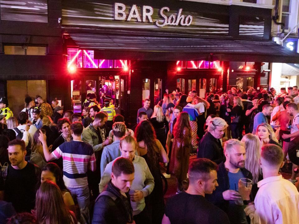 Revellers drink and socialise in the street in Soho, London, 4 July 2020: Vickie Flores/EPA