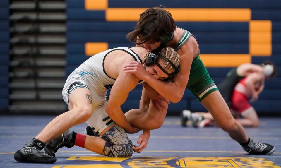 Cascades Logan Bickel wrestles Monrovia Isaac Ash in the 113-pound weight class finals during the sectional championships meet on Saturday, Jan. 29, 2022, at Mooresville High School in Mooresville. 