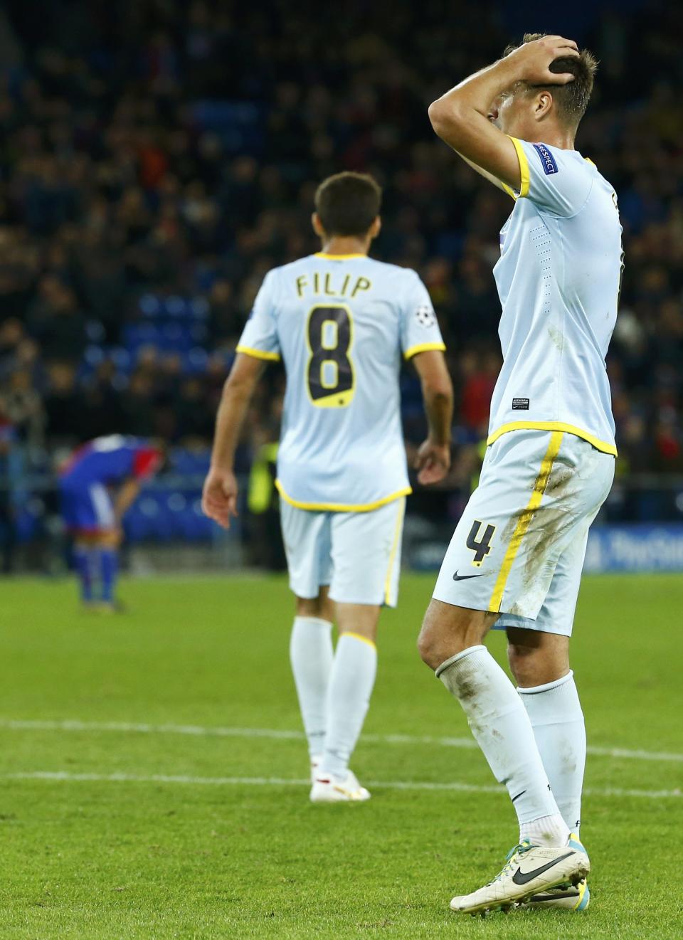 Steaua Bucharest's Lukasz Szukala reacts after a goal was scored by FC Basel during their Champions League Group E soccer match at St. Jakob-Park in Basel November 6, 2013. REUTERS/Ruben Sprich (SWITZERLAND - Tags: SPORT SOCCER)