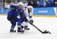 Ice Hockey - Pyeongchang 2018 Winter Olympics - Men's Playoff Match - Slovenia v Norway - Gangneung Hockey Centre, Gangneung, South Korea - February 20, 2018 - Mitja Robar of Slovenia and Mathis Olimb of Norway in action. REUTERS/Kim Kyung-Hoon