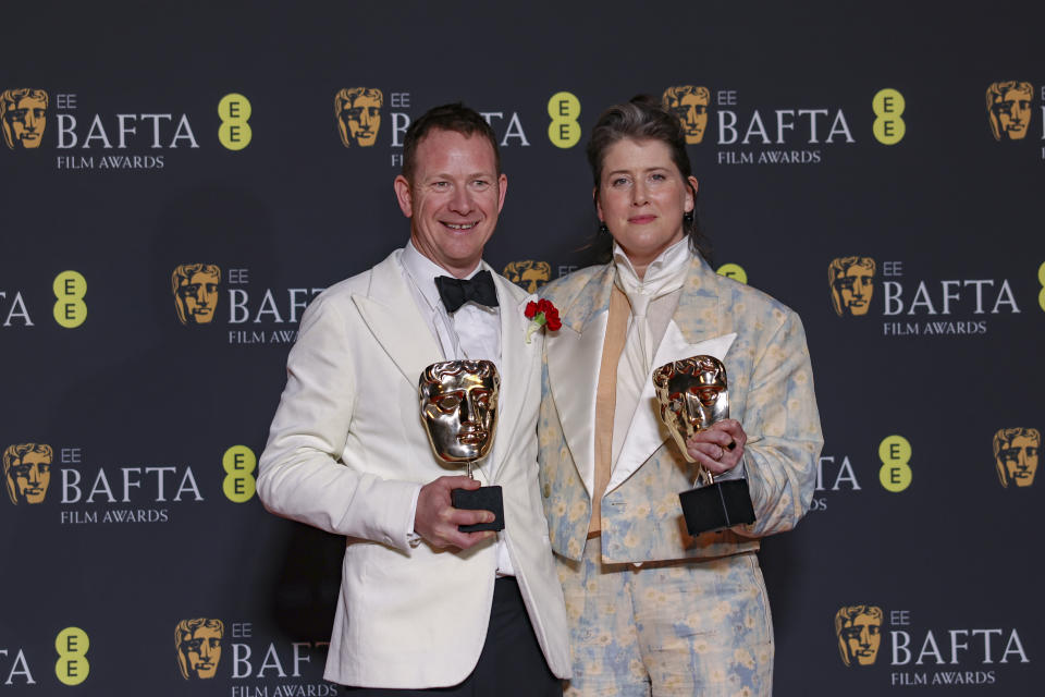James Price, left, and Shona Heath winners of the best production design award for 'Poor Things', pose for photographers at the 77th British Academy Film Awards, BAFTA's, in London, Sunday, Feb. 18, 2024. (Photo by Vianney Le Caer/Invision/AP)
