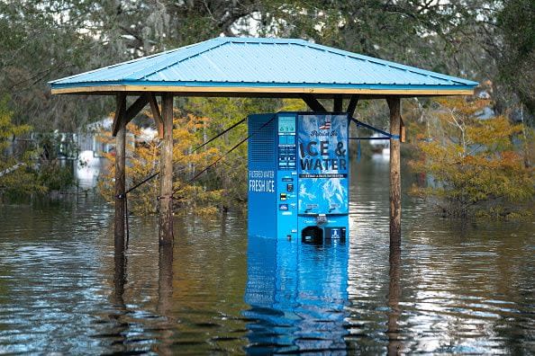 An ice and water machine sits in floodwaters in the wake of Hurricane Ian at the Peace River Campground on October 4, 2022, in Arcadia, Florida. Fifty miles inland, and nearly a week after Hurricane Ian made landfall on the Gulf Coast of Florida, the record-breaking floodwaters in the area are receding to reveal the full effects of the storm.