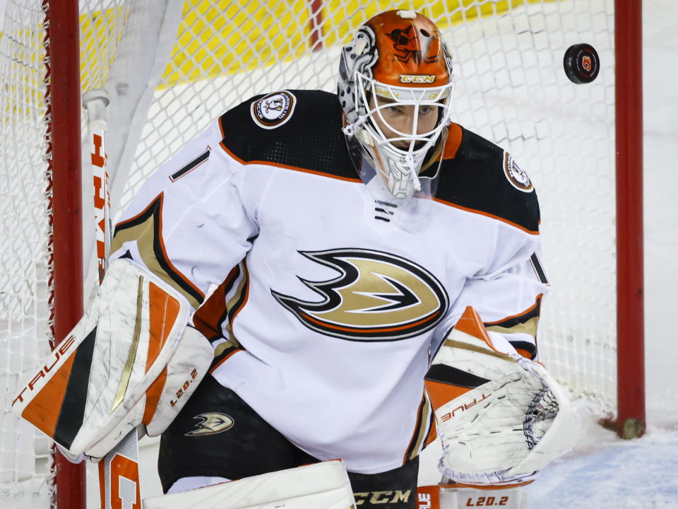 Anaheim Ducks goalie Lukas Dostal watches the puck during first-period NHL hockey game action against the Calgary Flames in Calgary, Alberta, Sunday, April 2, 2023. (Jeff McIntosh/The Canadian Press via AP)