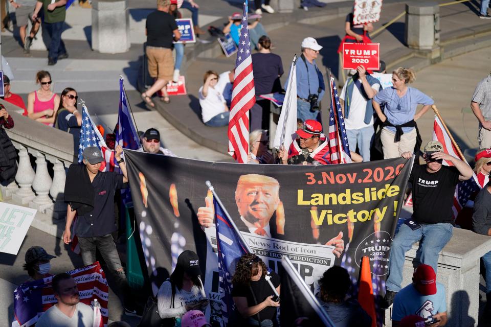 Supporters of President Donald Trump demonstrate near the Pennsylvania State Capitol, Saturday, Nov. 7, 2020, in Harrisburg, Pa., after Democrat Joe Biden defeated Trump to become 46th president of the United States.