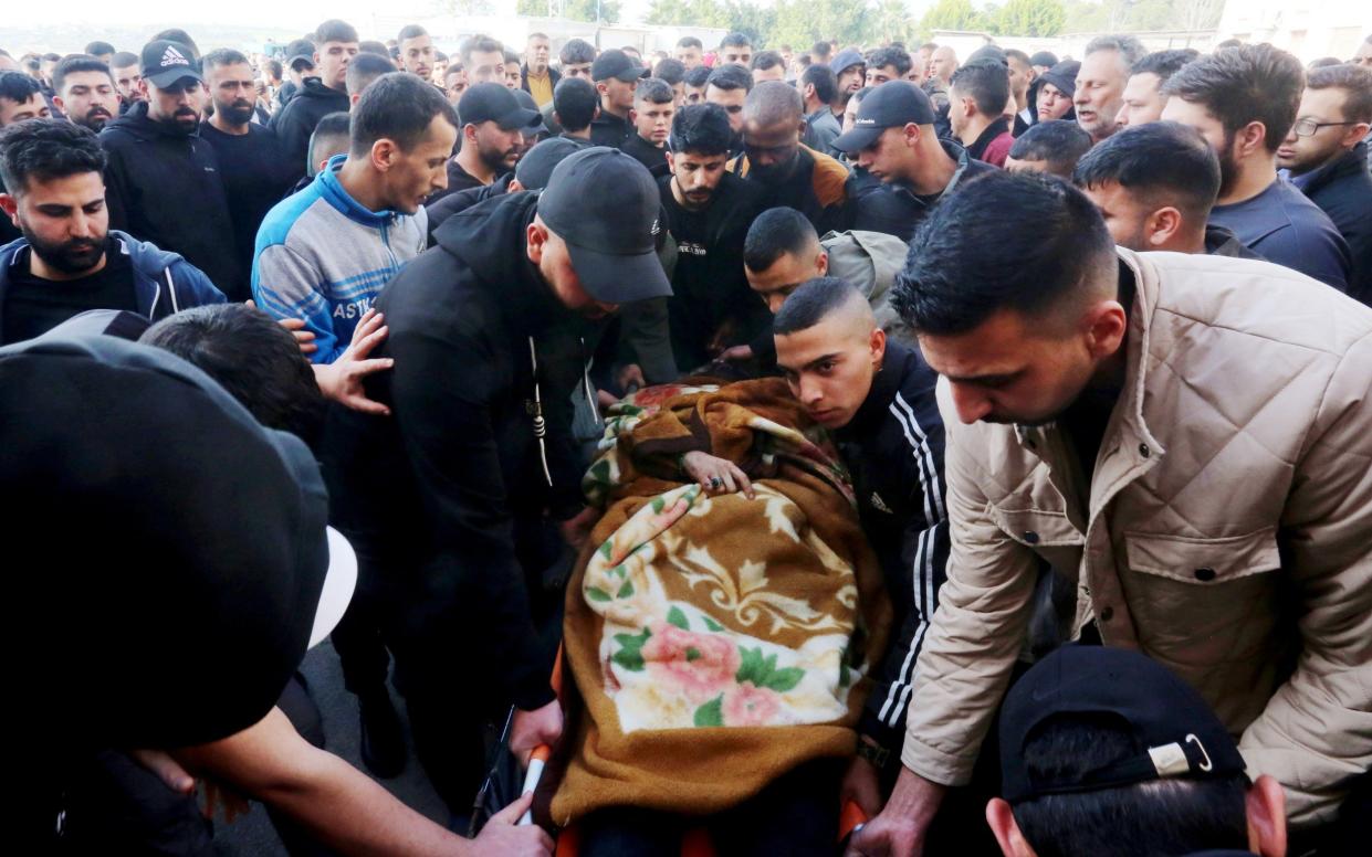 The body of Muhammad Rasoul Daraghmeh is brought to a hospital in Tubas, West Bank