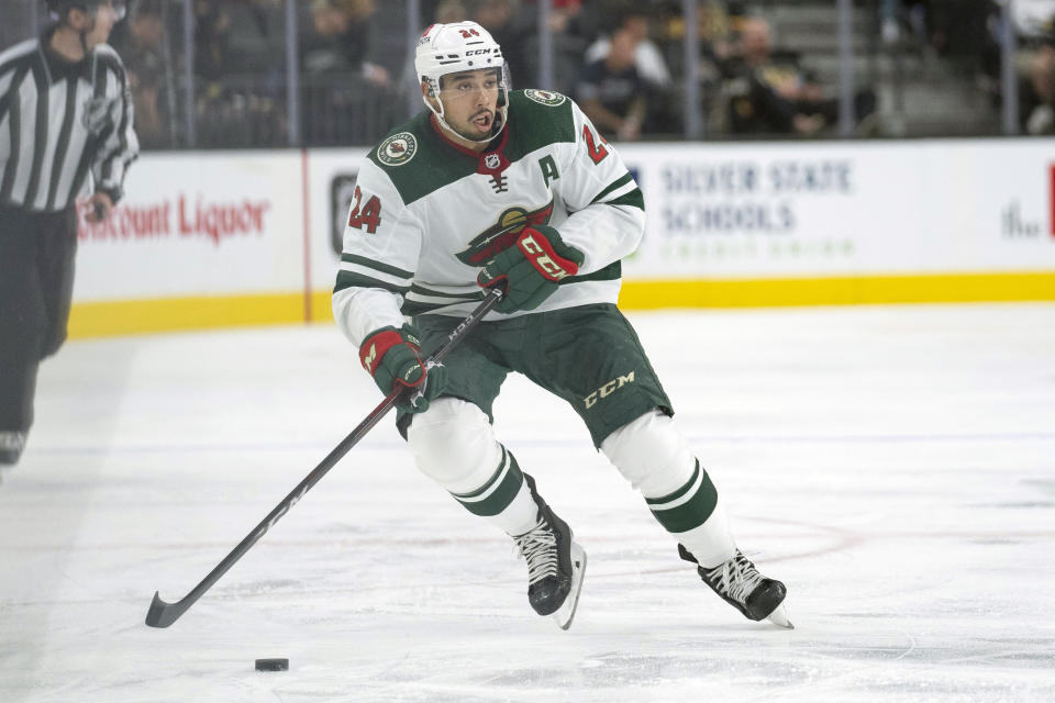 FILE - Minnesota Wild defenseman Matt Dumba (24) advances the puck during a game against the Vegas Golden Knights Thursday, Nov. 11, 2021, in Las Vegas. Two years since Matt Dumba took a knee to focus attention on society and the NHL's issues with racial intolerance, the Minnesota Wild defenseman no longer feels alone. (AP Photo/Eric Jamison, File)