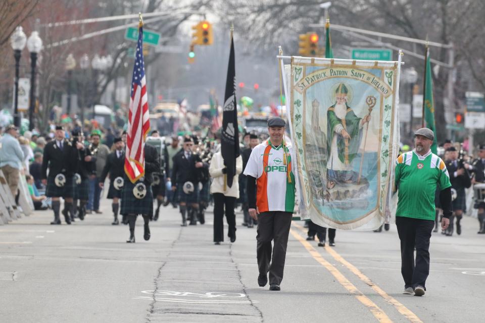 The St. Patrick’s banner leads the Morristown St. Patrick’s Day Parade down South St. in Morristown, NJ on March 19, 2022.