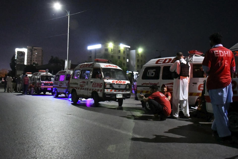Ambulances are parked close to the incident site following gunmen attack on police headquarters, in Karachi, Pakistan, Friday, Feb. 17, 2023. Militants launched a brazen attack on the police headquarters of Pakistan's largest city on Friday, officials said, as the sound of gunfire and grenade explosions rocked the heart of Karachi. (AP Photo/Ikram Suri)