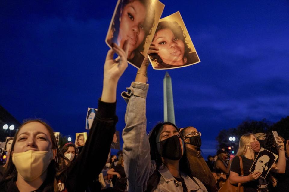 WASHINGTON, DC - SEPTEMBER 23: Demonstrators march from the U.S. Department of Justice to the White House in a call for justice for Breonna Taylor, who was killed by a member of the Louisville Police Department during a middle-of-the-night raid of Taylor's apartment, in Washington, DC, on Wednesday, September 23, 2020.  The actions of the officer who killed Taylor has been ruled justified while another of the three officers was indicted on a warrant endangerment charge. (Photo by Jahi Chikwendiu/The Washington Post via Getty Images)