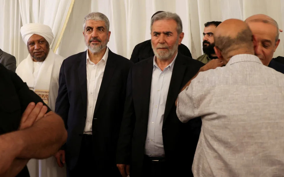 Khaled Meshaa, left, next to Ziad al-Nakhalah, the Islamic Jihad chief