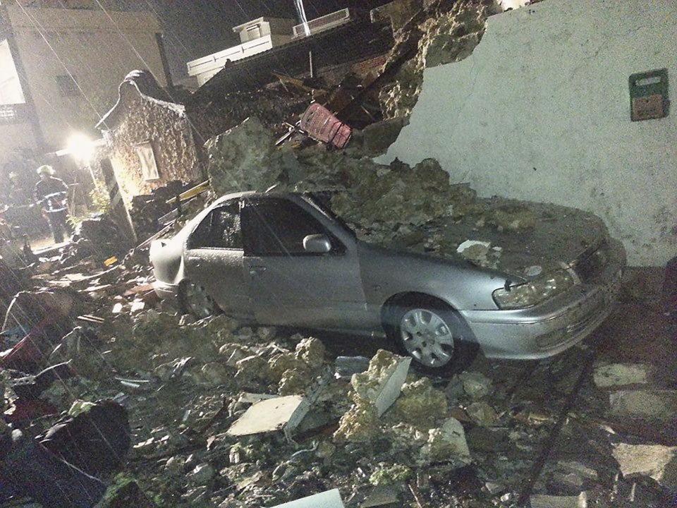 A car is seen covered in rubble from the wreckage of TransAsia Airways flight GE222 on Taiwan's offshore island of Penghu, July 23, 2014. A TransAsia Airways turboprop ATR-72 plane crashed on its second attempt at landing during a thunderstorm on Penghu, an island off Taiwan on Wednesday, killing 47 people and setting buildings on fire, officials said. (REUTERS/Wong Yao-wen)