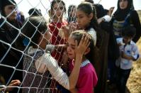 Newly displaced Iraqi's who fled from the city of Mosul, Iraq's last major Islamic State (IS) group stronghold, are reunited with their relatives who came two years ago to the refugee camp in the Khazer area