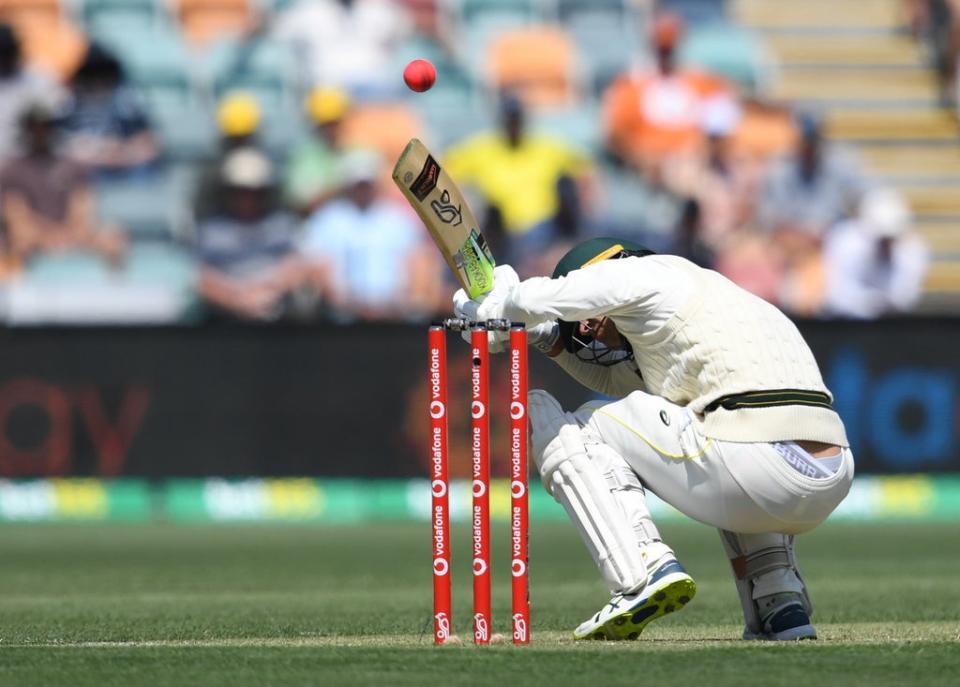 Australia’s Alex Carey ducks under a bouncer bowled by England’s Mark Wood (Darren England via AAP/PA) (PA Media)