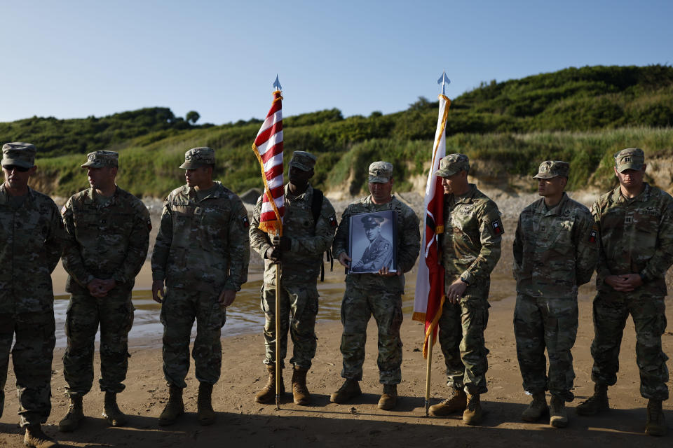 Soldiers of the First U.S. Army hold a ceremony on Omaha Beach in Colleville-sur-Mer, France on Friday, June 7, 2024, to honor Waverly Woodson Jr., a medic who was part of the only Black combat unit to take part in the D-Day invasion of France during World War II, being posthumously awarded the Distinguished Service Cross in recognition of the heroism and determination he showed treating troops under heavy enemy fire. The Distinguished Service Cross is the second-highest honor that can be bestowed on a member of the Army and is awarded for extraordinary heroism. (AP Photo/Jeremias Gonzalez)