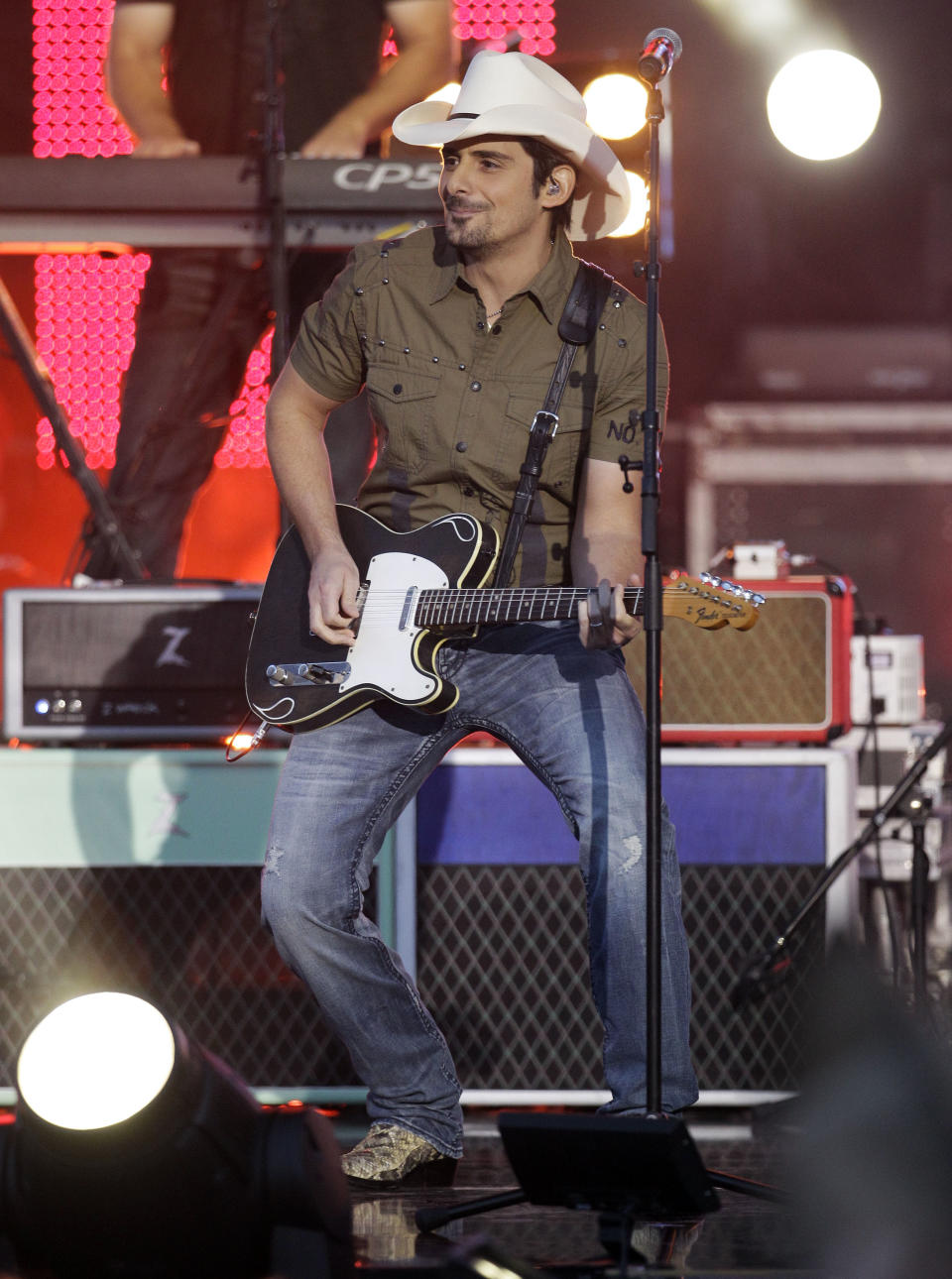 Brad Paisley performs on an outdoor stage during the CMT Music Awards show on Wednesday, June 6, 2012, in Nashville, Tenn. (AP Photo/Mark Humphrey)