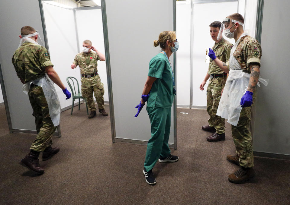 Soldiers practice on themselves at the Liverpool Tennis Centre in Wavertree, before the start of the mass Covid-19 testing in Liverpool. (Photo by Peter Byrne/PA Images via Getty Images)