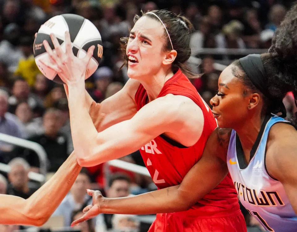 Fever guard Caitlin Clark (22) drives toward the basket against the Sky during a game at Grainbridge Fieldhouse in Indianapolis on June 1, 2024.