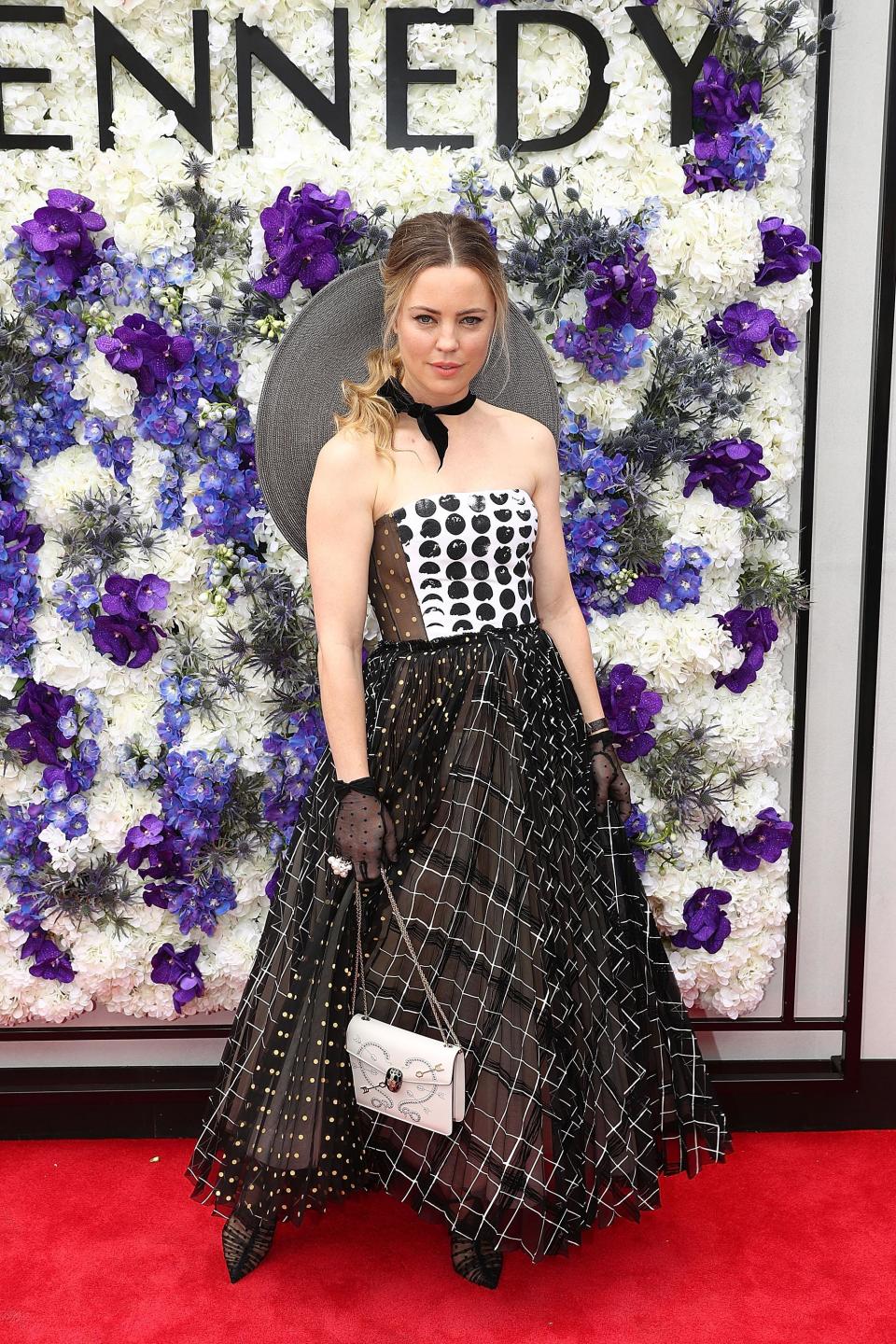 <p>Melissa George went for a very mismatched look in this frock that was littered with multiple patterns and colours.</p>