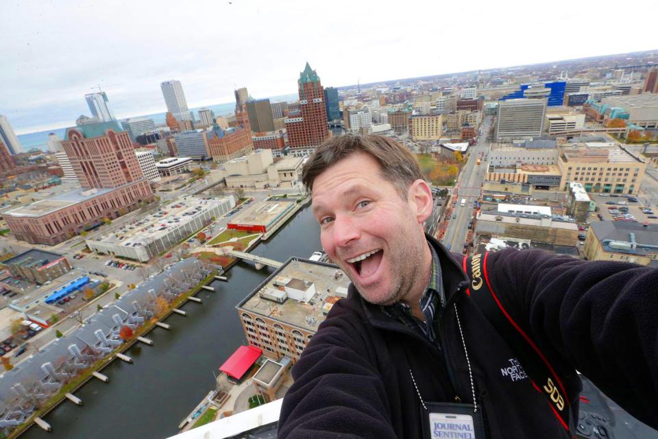 Milwaukee Journal Sentinel photographer Mike De Sisti takes a selfie on top of the 30-story Moderne apartment high-rise at West Juneau and North King Drive while documenting the views from high places around Milwaukee for his Highview project in 2012.