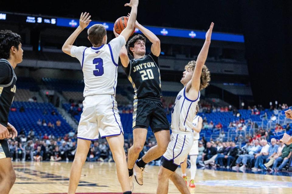 Championship Game MVP Colt Gentry of Jayton (20) tries to get a shot off against Benjamin’s Keegan Hayes (4) and Weston Weatherford (3) in the Class 1A state championship game on Saturday, March 9, 2024 at the Alamodome in San Antonio, Texas. Jayton defeated Benjamin 60-53.