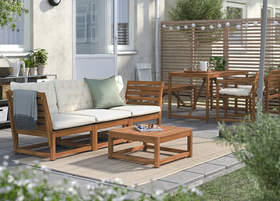  A backyard with outdoor furniture on a small patio 