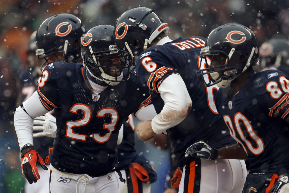 Quarterback Jay Cutler of the Chicago Bears celebrates his six-yard touchdown run with Devin Hester.