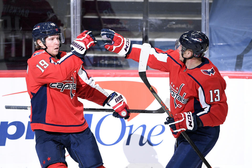 Washington Capitals center Nicklas Backstrom (19) celebrates his goal with left wing Jakub Vrana (13) during the first period of an NHL hockey game against the Buffalo Sabres, Friday, Jan. 22, 2021, in Washington. (AP Photo/Nick Wass)