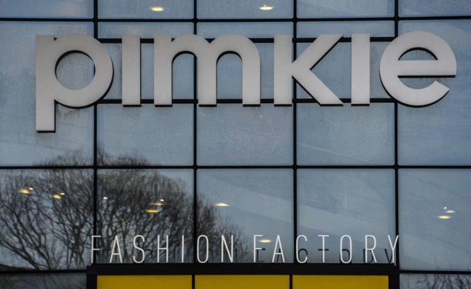 This photograph taken on January 8, 2018, shows the sign of 'ready to wear' clothing company 'Pimkie' on the company building in Villeneuve d'Ascq, northern France. - The management of the women's ready-to-wear chain Pimkie (Mulliez group) has presented to the elected representatives of the staff a project of 208 job cuts, via a collective breaks collective, AFP has learned from union sources. This project, presented to the Central Works Council meeting at the Pimkie headquarters in Villeneuve d'Ascq (North), is the first application of a scheme created by the 