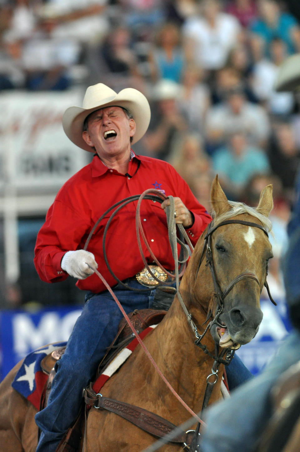 In this Aug. 20, 2010 file photo, Idaho Gov. C.L. "Butch" Otter works the heels of a calf while team roping with the Pro Rodeo Cowboys Association commissioner Karl Stressman at the Caldwell Night Rodeo in Caldwell, Idaho. (AP Photo/Idaho Press-Tribune, Charlie Litchfield, File)