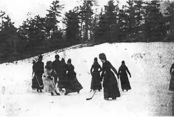 Lady Isobel Gathorne-Hardy, in white, battles for the puck in this all-female match at Rideau Hall in 1890. This is believed to be the first photograph depicting women playing hockey.