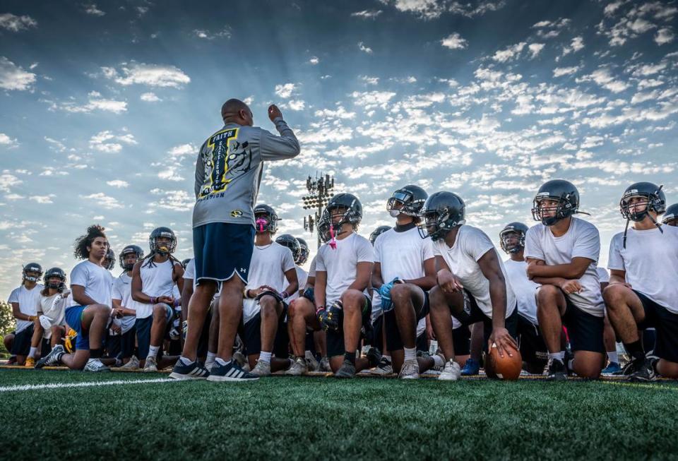 Inderkum High School coach Reggie Harris gives instructions on weightlifting and class schedules to players after an early morning practice in 2022. Hector Amezcua/hamezcua@sacbee.com