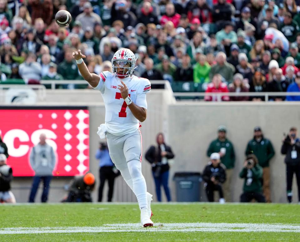 Oct 8, 2022; East Lansing, Michigan, USA; Ohio State Buckeyes quarterback C.J. Stroud (7) throws the ball in the first quarter of the NCAA Division I football game between the Ohio State Buckeyes and Michigan State Spartans at Spartan Stadium.<br>Osu22msu Kwr 20
