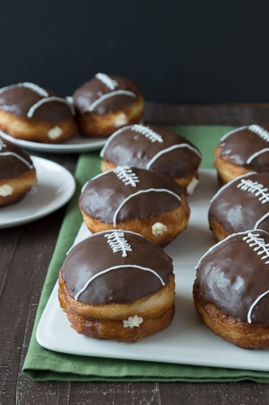 <p>The First Year Blog</p><p><strong>Get the recipe: </strong><a href="https://thefirstyearblog.com/cream-filled-chocolate-football-donuts/" rel="nofollow noopener" target="_blank" data-ylk="slk:Cream-Filled Chocolate Football Donuts;elm:context_link;itc:0;sec:content-canvas" class="link "><strong>Cream-Filled Chocolate Football Donuts</strong></a></p>