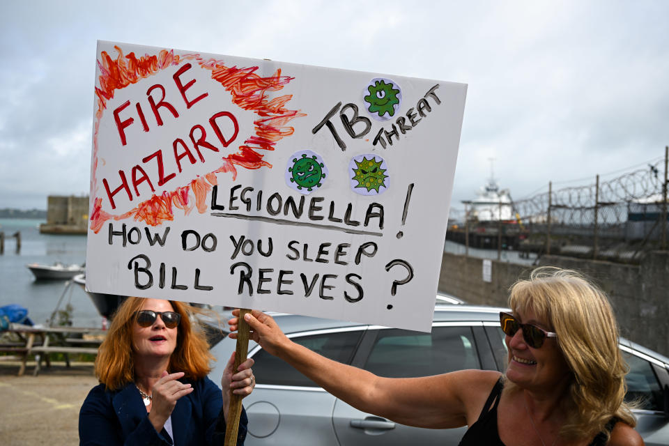 PORTLAND, ENGLAND - AUGUST 13: Protesters against the Bibby Stockholm immigration barge target Portland Port after the arrival of the cruise ship Regal Princess, on August 13, 2023 in Portland, England. More than three dozen migrants who arrived on the Bibby Stockholm barge this week have been temporarily relocated after traces of legionella bacteria were found in the barge's water supply. The Home Office has leased the barge to provide accommodation for asylum seekers and reduce its use of hotels. (Photo by Finnbarr Webster/Getty Images)