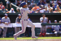 Texas Rangers' Marcus Semien watches his ball while hitting a solo home run against the Baltimore Orioles during the ninth inning of a baseball game, Monday, July 4, 2022, in Baltimore. The Orioles won 7-6 in ten innings. (AP Photo/Julio Cortez)