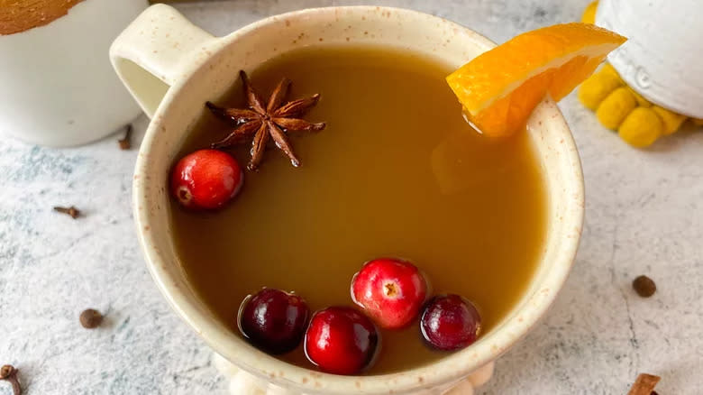 Cider mug with cranberries, orange, and star anise