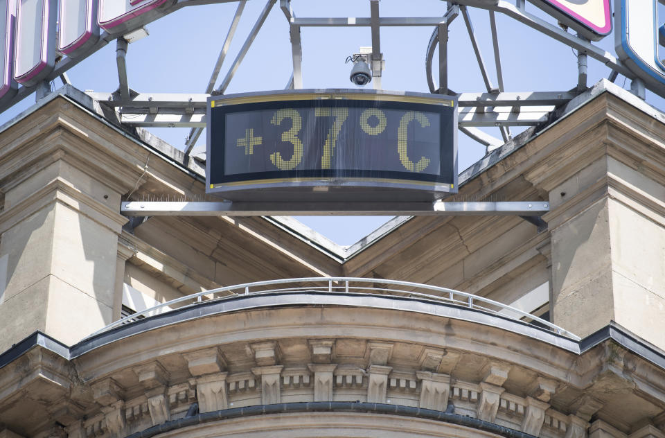 A sign shows 37 degrees Celsius at a building in the city of Stuttgart, Germany, Wednesday, June 26, 2019. Germany and Europe is hit by a heatwave with temperatures near 40 degrees. (Marijan Murat/dpa via AP)