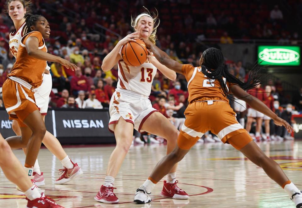 Iowa State's Maggie Espenmiller-McGraw (13) and Texas' Aliyah Matharu (2) battle for the ball during Wednesday's game at Hilton Coliseum.