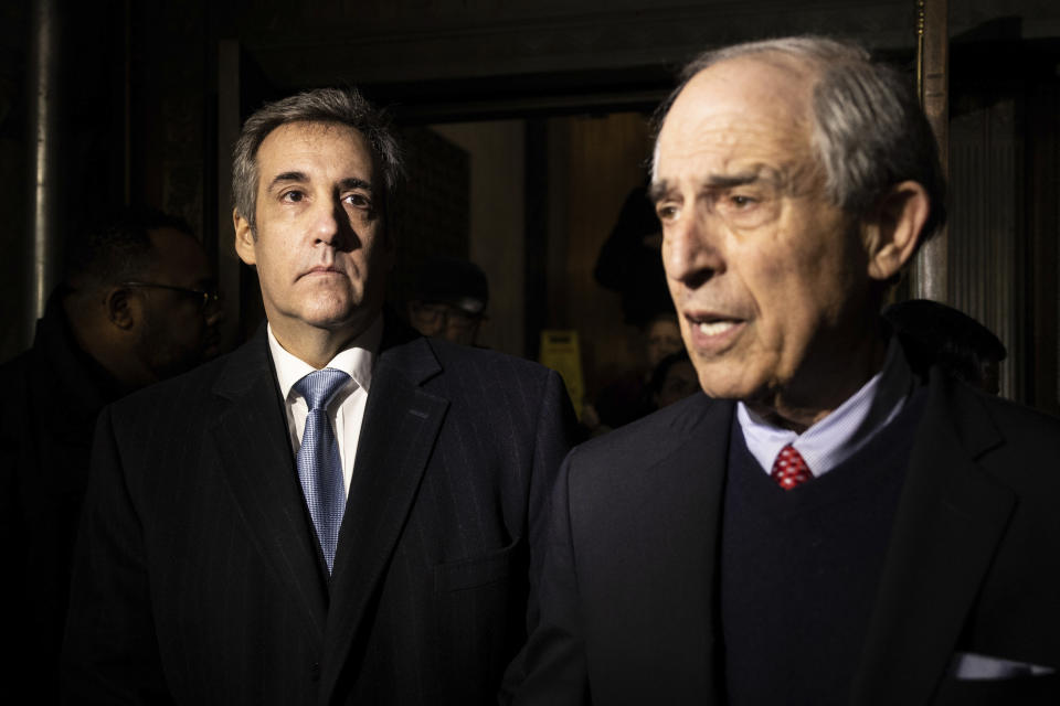 Michael Cohen, left, leaves the District Attorney's office after testifying before a grand jury in New York, Monday, March. 13, 2023. (AP Photo/Yuki Iwamura)