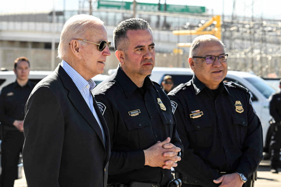 President Joe Biden speaks with Customs and Border Protection police on the Bridge of the Americas border crossing with Mexico in El Paso, Texas, on Jan. 8, 2023. (Jim Watson / AFP - Getty Images)
