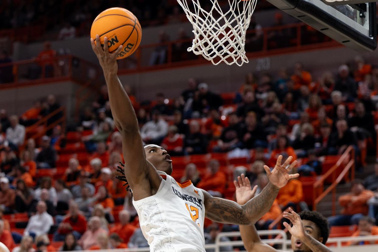 Jan 6, 2024; Stillwater, Okla, USA; Oklahoma State Cowboys guard Javon Small (12) shoots a layup in the second half of an NCAA menÕs basketball game against the Baylor Bears 11at Gallagher-Iba arena. Mandatory Credit: Mitch Alcala-The Oklahoman