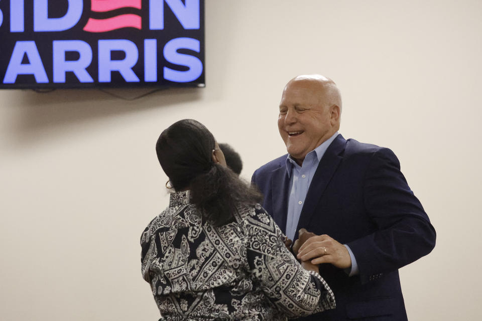 Mitch Landrieu, former mayor of New Orleans and current senior adviser to President Joe Biden, speaks with a Democratic supporter at a meeting of the Democratic Committee of North Carolina at the Word of Tabernacle Church in Rocky Mount, N.C., Thursday, May 23, 2024. (AP Photo/Karl B DeBlaker)