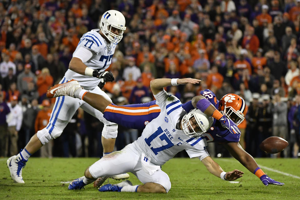 CLEMSON, SOUTH CAROLINA - NOVEMBER 17: Defensive lineman Christian Wilkins #42 of the Clemson Tigers tackles quarterback Daniel Jones #17 of the Duke Blue Devils as offensive tackle Robert Kraeling #77 of the Duke Blue Devils rushes in during their football game at Clemson Memorial Stadium on November 17, 2018 in Clemson, South Carolina. (Photo by Mike Comer/Getty Images)