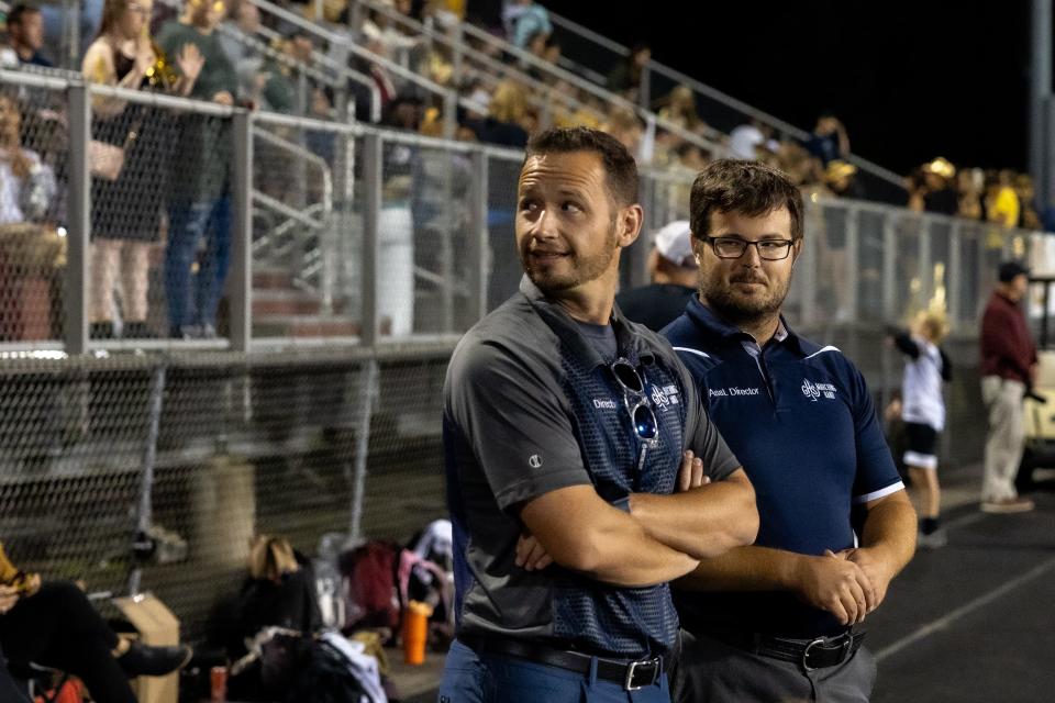 Director Jerod Smith (left) and Assistant Director Andrew Krumm at the Granville High School game against Licking Heights High School. Smith is in his 11th year at Granville.